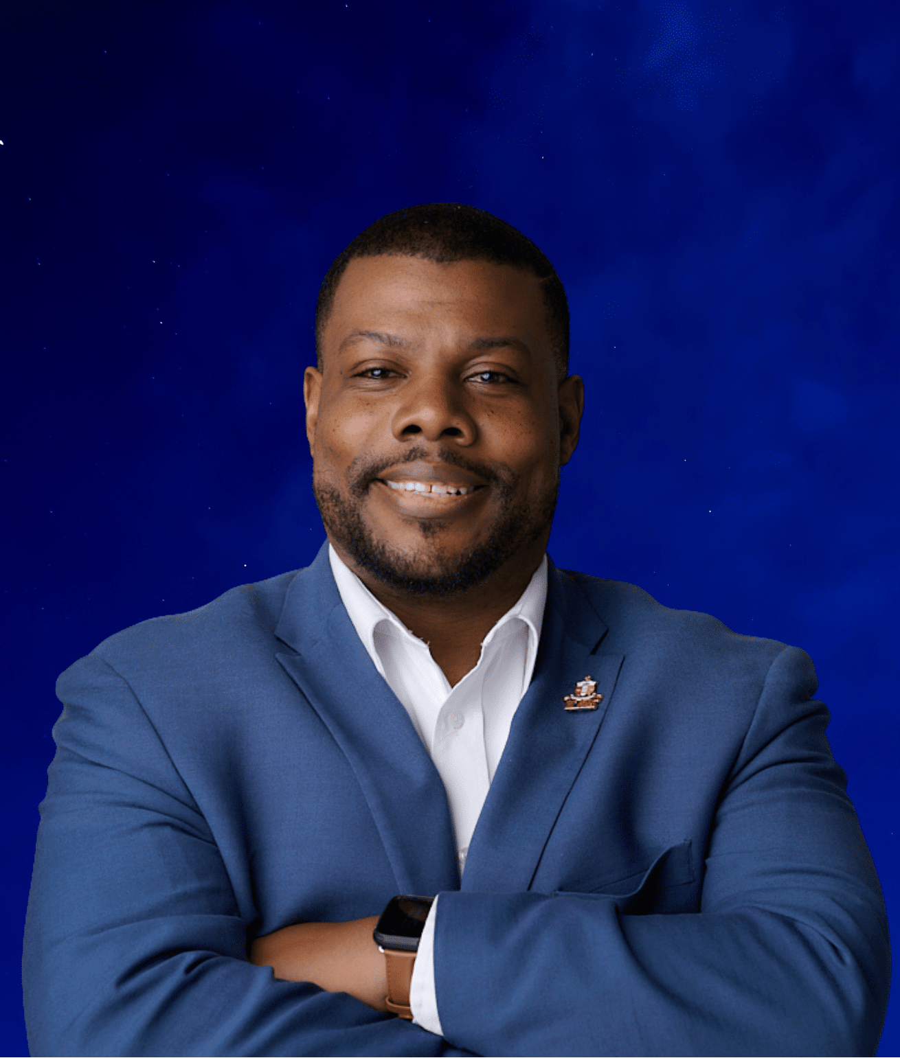 Carl, a smiling man with a beard and a blue suit, arms crossed